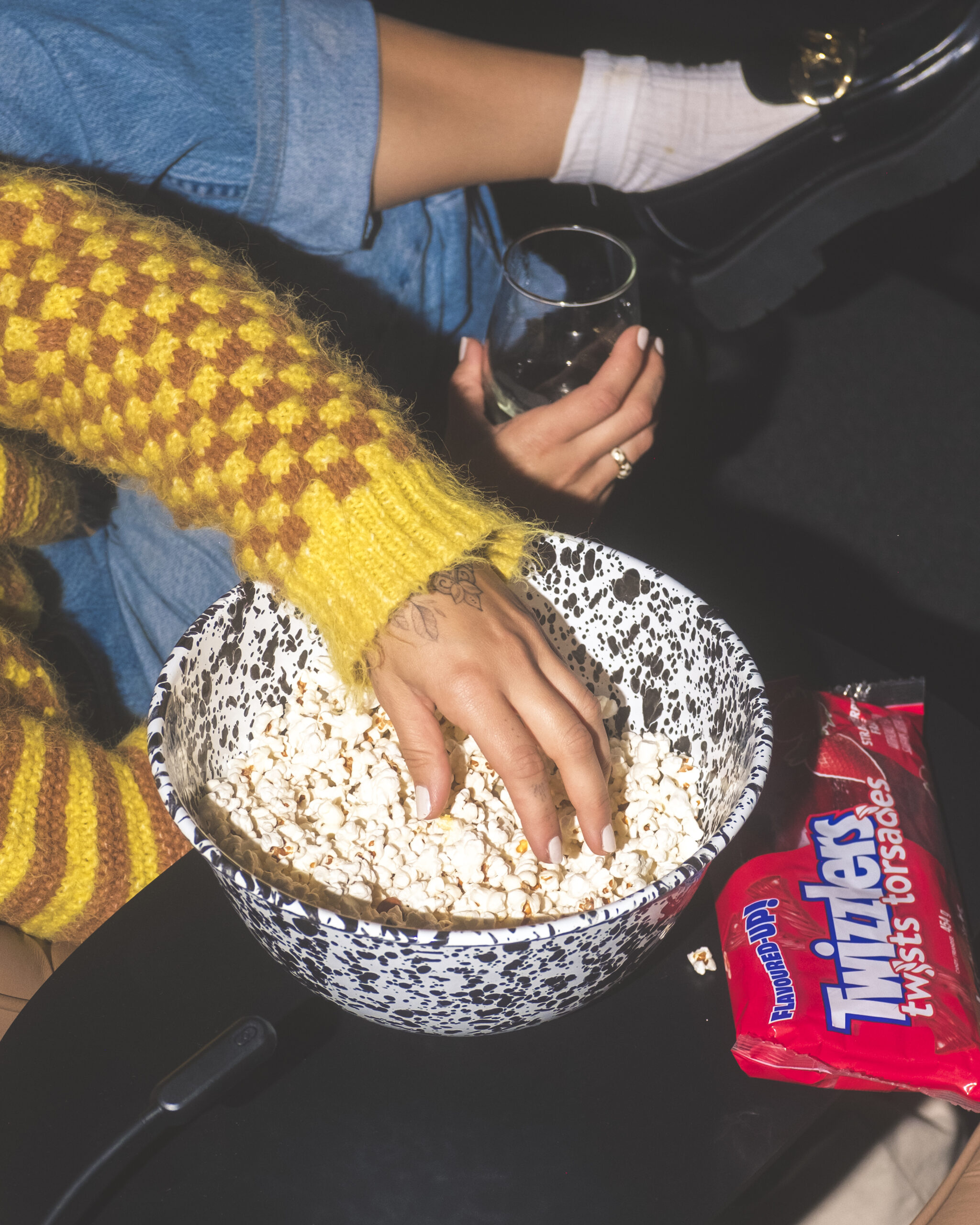 Bernie's Cinema Kelowna, Hand grabbing popcorn.