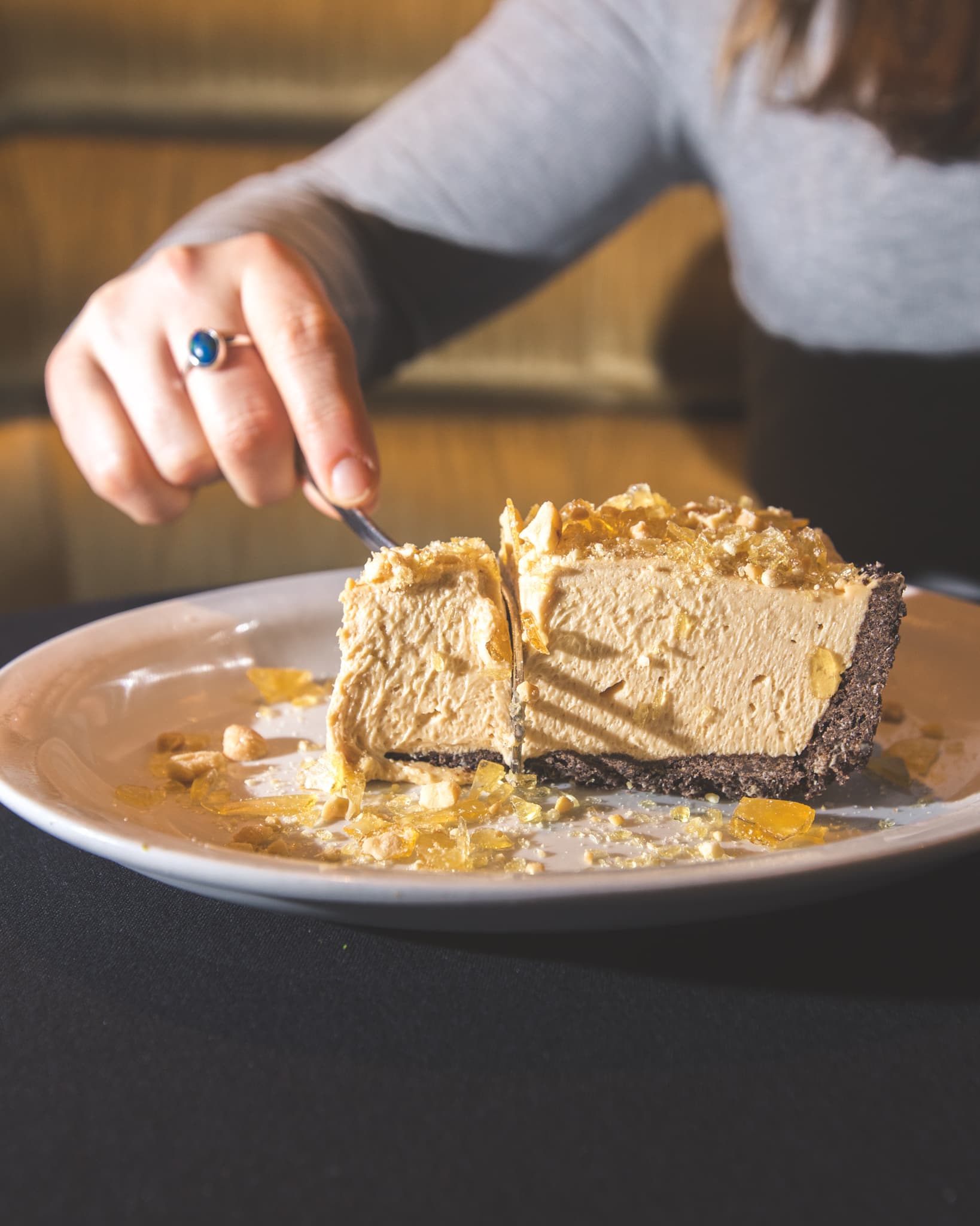 Fork slicing through peanut butter mousse pie